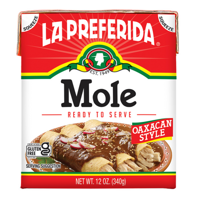 Front of La Preferida Mole Oaxacan Style 12oz carton, ready-to-serve vegan mole sauce, easy to use for authentic Oaxacan mole recipes.
